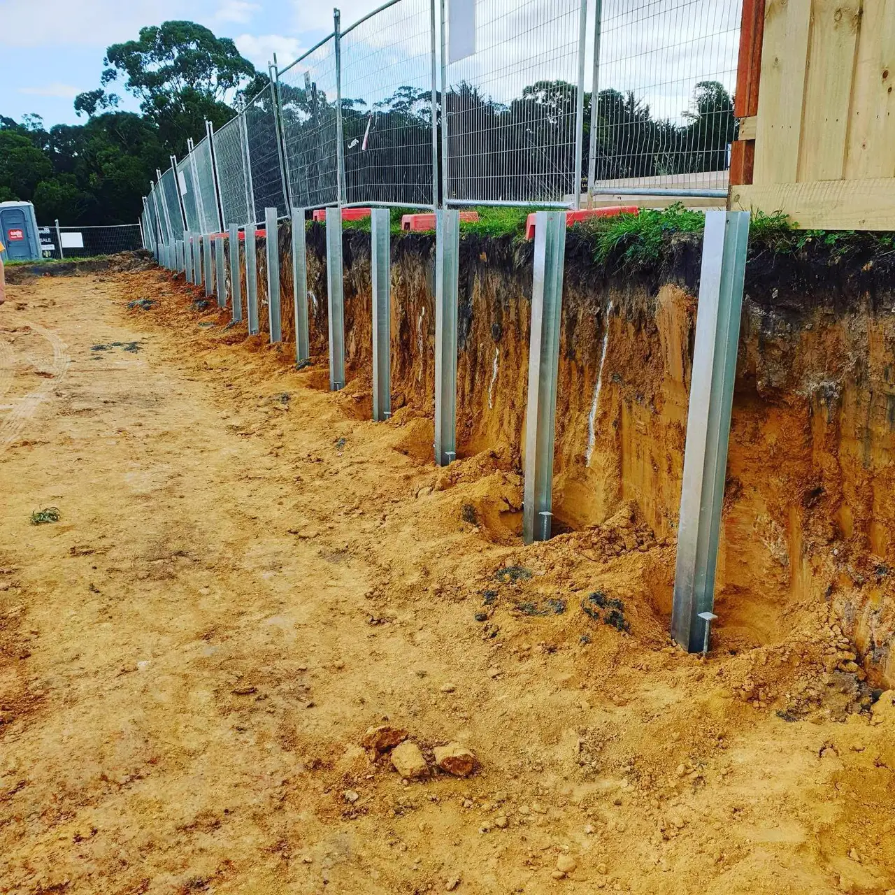 Retaining wall structure and excavation in progress