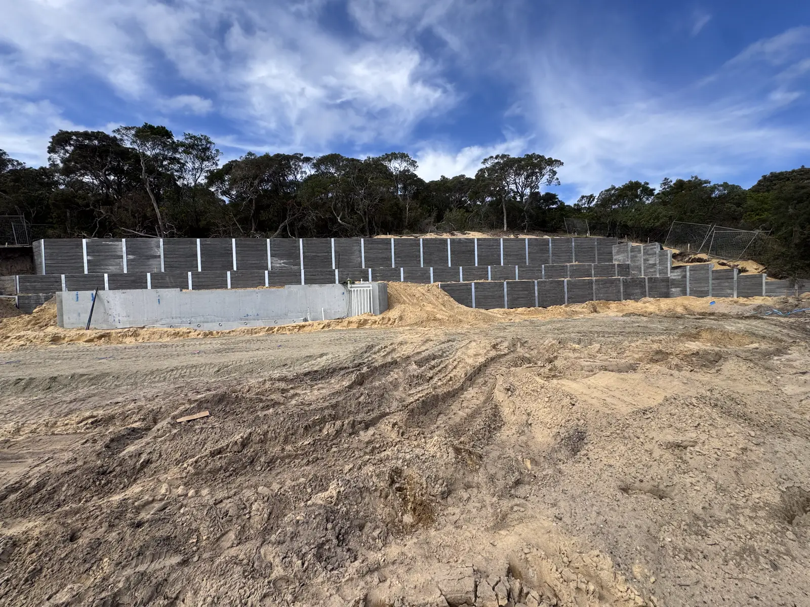 Large multi-tier concrete sleeper retaining wall built by Align Excavation Group
